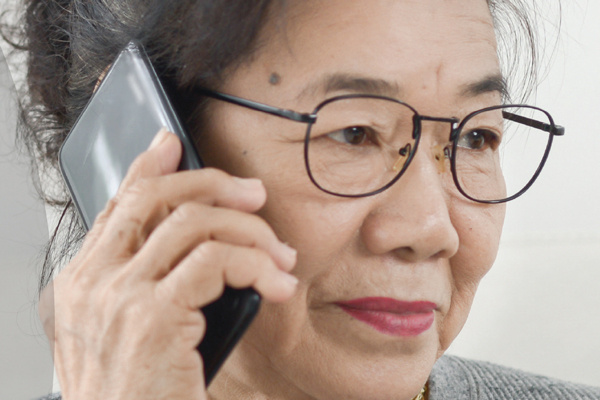 An older woman on the phone