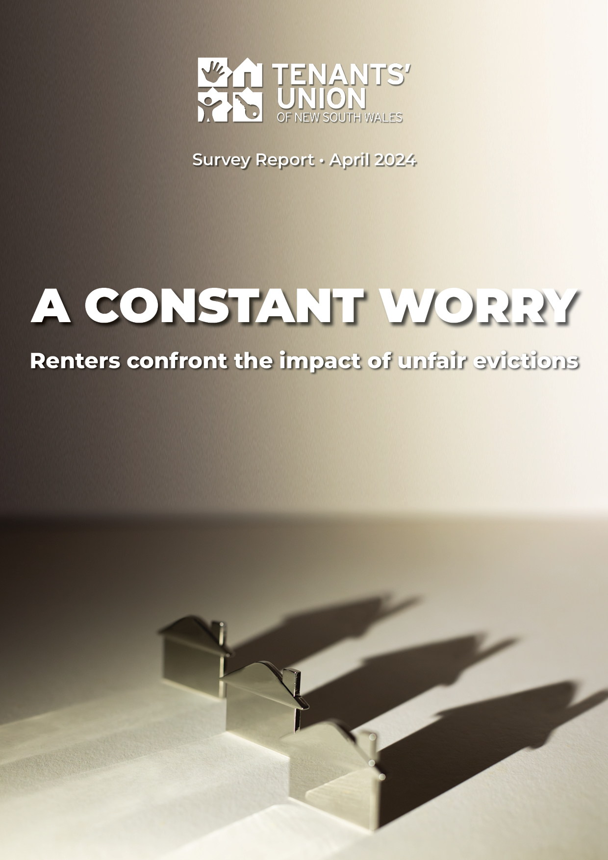Report cover with stylised photo of three house shapes with looming shadows