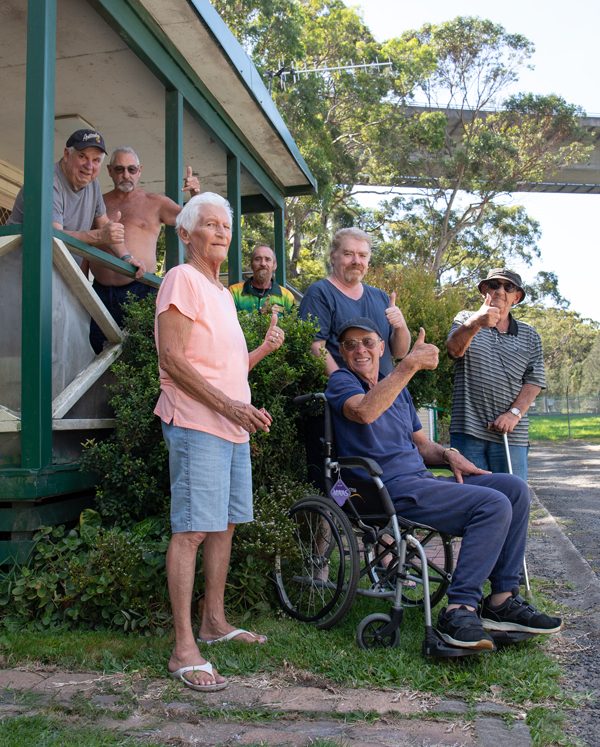 Smiling residents, giving a thumbs up